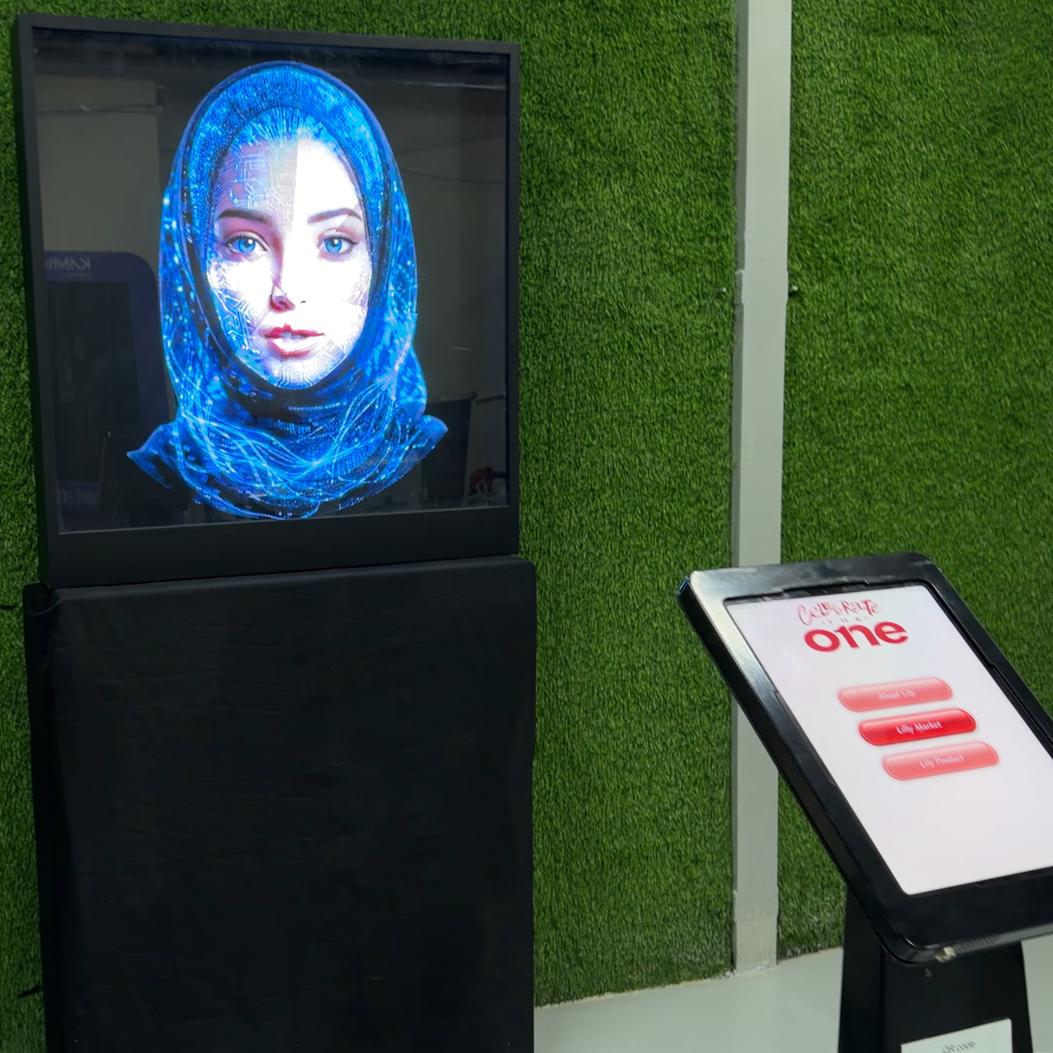 AI kiosk at an event features a digital display of a ai hologram woman in a blue hijab